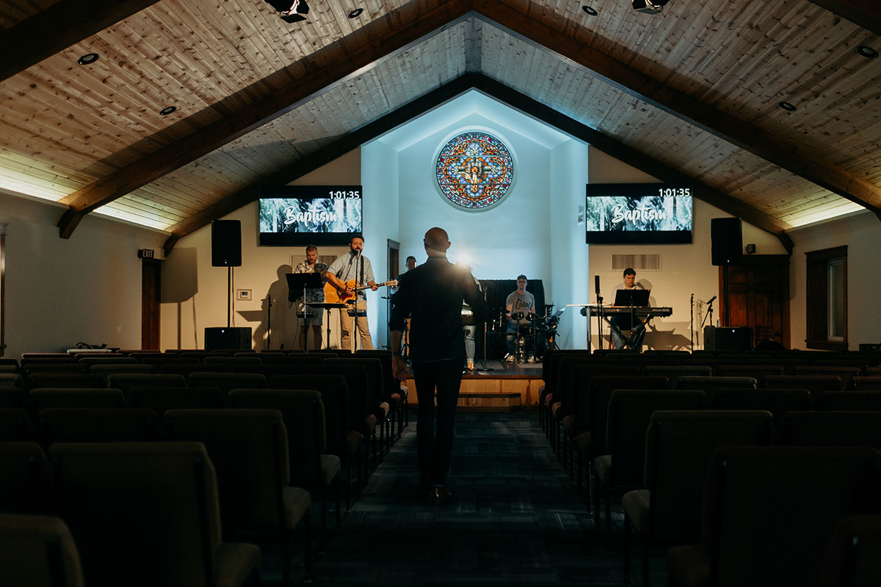 The Seed band practices in front of an empty sanctuary.