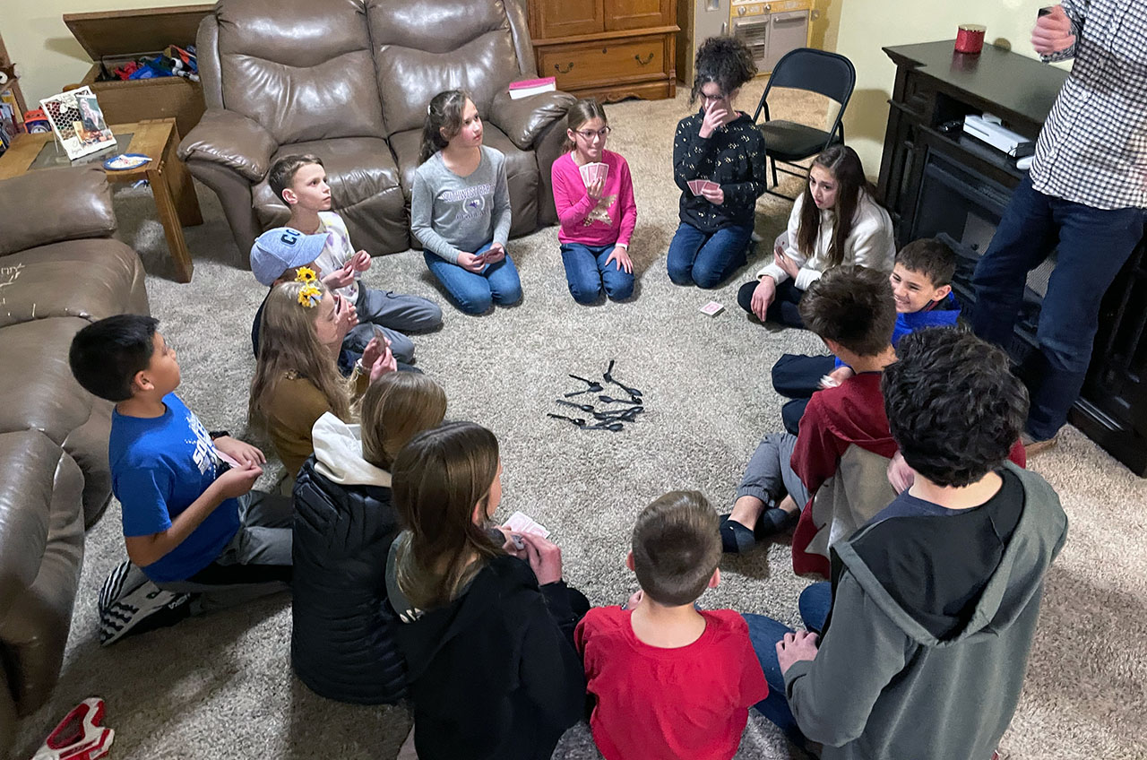 A group of children playing spoons